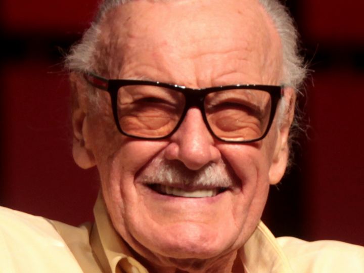 Stan Lee smiling at a fan convention